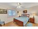 Bedroom with wood flooring and ceiling fan at 1572 Nimbus Dr, North Port, FL 34287