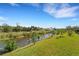 Scenic view of canal from backyard, offering tranquility at 1572 Nimbus Dr, North Port, FL 34287