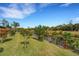 Relaxing backyard view of a peaceful canal and lush greenery at 1572 Nimbus Dr, North Port, FL 34287