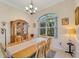 Formal dining room with a wooden table and hutch at 1572 Nimbus Dr, North Port, FL 34287