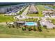 Aerial view of community featuring resort-style pool, clubhouse, and golf course at 18114 Gawthrop Dr # 404, Bradenton, FL 34211