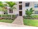 Apartment building exterior with landscaping and walkway at 18114 Gawthrop Dr # 404, Bradenton, FL 34211