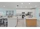 Modern kitchen with white cabinets and large island at 18114 Gawthrop Dr # 404, Bradenton, FL 34211