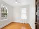 Simple bedroom with hardwood floors and window at 202 27Th W St, Bradenton, FL 34205