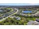 Aerial view of community with lake and homes at 2028 Woodleaf Hammock Ct, Bradenton, FL 34211