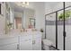 Elegant bathroom with a frameless shower and patterned tile at 2028 Woodleaf Hammock Ct, Bradenton, FL 34211