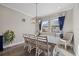 Bright dining room featuring a large table and six chairs at 2028 Woodleaf Hammock Ct, Bradenton, FL 34211