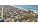 Aerial view of a beachside neighborhood with single-Gathering homes at 203 72Nd St, Holmes Beach, FL 34217