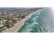 Aerial view showing beachfront property and ocean waves at 203 72Nd St, Holmes Beach, FL 34217