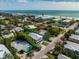 Aerial view of a two-story home near the beach with ocean access at 203 72Nd St, Holmes Beach, FL 34217