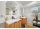 Modern bathroom with double sinks and light wood cabinets at 203 72Nd St, Holmes Beach, FL 34217