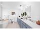 Modern bathroom with dual vanities and a free-standing bathtub at 203 72Nd St, Holmes Beach, FL 34217