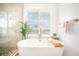 Relaxing bathroom with soaking tub and large window at 203 72Nd St, Holmes Beach, FL 34217