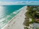 Expansive beach view with turquoise water and white sand at 203 72Nd St, Holmes Beach, FL 34217