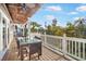 Outdoor deck with table and chairs, offering scenic views at 203 72Nd St, Holmes Beach, FL 34217