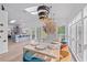 Bright dining room with a modern table, view of kitchen and deck at 203 72Nd St, Holmes Beach, FL 34217