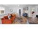 Open living space with orange couch and built-in shelving at 203 72Nd St, Holmes Beach, FL 34217