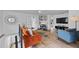 Upstairs living area with orange couch and built-in shelving at 203 72Nd St, Holmes Beach, FL 34217