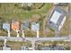 Bird's-eye view of three homes and a nearby gas station at 2053 Rio De Janeiro Ave, Punta Gorda, FL 33983