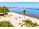 Relaxing beach scene with calm waters and palm trees at 2053 Rio De Janeiro Ave, Punta Gorda, FL 33983