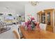 Bright dining room with a wooden table, chandelier, and decorative plants at 2053 Rio De Janeiro Ave, Punta Gorda, FL 33983