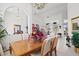 Bright dining room with a wooden table, chandelier, and decorative plants at 2053 Rio De Janeiro Ave, Punta Gorda, FL 33983