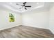 Light and airy bedroom featuring ceiling fan and large window at 2133 Selover Rd, North Port, FL 34287