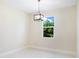 Bright dining room with chandelier and window at 2133 Selover Rd, North Port, FL 34287