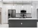 Modern kitchen with stainless steel appliances and white cabinets at 2133 Selover Rd, North Port, FL 34287