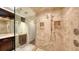 Elegant bathroom with a large walk-in shower and double vanity at 2195 Harbourside Dr # 404, Longboat Key, FL 34228