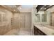 Spa-like bathroom with large shower, double vanity, and heated towel rack at 2195 Harbourside Dr # 404, Longboat Key, FL 34228