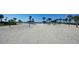 Beachfront volleyball court with shaded picnic areas at 2195 Harbourside Dr # 404, Longboat Key, FL 34228