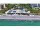 Aerial view of beach, boardwalk, and ocean at 2195 Harbourside Dr # 404, Longboat Key, FL 34228