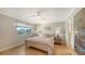 Charming bedroom with light walls, ceiling fan, and hardwood floors at 2195 Harbourside Dr # 404, Longboat Key, FL 34228