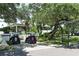 Golf clubhouse surrounded by lush landscaping and golf carts at 2195 Harbourside Dr # 404, Longboat Key, FL 34228