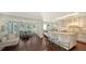 Modern kitchen with white cabinets, granite island, and hardwood floors at 2195 Harbourside Dr # 404, Longboat Key, FL 34228