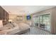 Spacious main bedroom with private balcony and stunning water views at 2195 Harbourside Dr # 404, Longboat Key, FL 34228