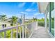 Bright balcony with rocking chairs and a view of the neighborhood at 2213 Avenue B, Bradenton Beach, FL 34217