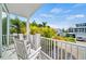 Relaxing balcony with rocking chairs overlooking the neighborhood at 2213 Avenue B, Bradenton Beach, FL 34217