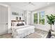 Main bedroom with a king-size bed and plenty of natural light at 2213 Avenue B, Bradenton Beach, FL 34217