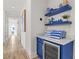 Hallway with blue built-in shelving and beachy decor at 2213 Avenue B, Bradenton Beach, FL 34217