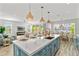 Open kitchen with island seating, modern cabinetry, and breakfast nook at 2213 Avenue B, Bradenton Beach, FL 34217