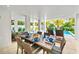 Outdoor dining area with table and chairs near the pool at 2213 Avenue B, Bradenton Beach, FL 34217