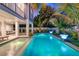 Inviting pool and spa with lounge chairs and outdoor seating at 2213 Avenue B, Bradenton Beach, FL 34217