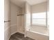 Bathroom with tub, shower, and wood-look flooring at 22419 Bette Ave, Port Charlotte, FL 33954