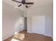 Bright bedroom featuring wood floors and ceiling fan at 22419 Bette Ave, Port Charlotte, FL 33954