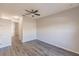 Bright bedroom with wood-look flooring and access to hallway at 22419 Bette Ave, Port Charlotte, FL 33954