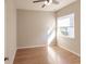 Bright bedroom with wood flooring and a ceiling fan at 22419 Bette Ave, Port Charlotte, FL 33954