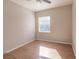 Well-lit bedroom with wood flooring and a window at 22419 Bette Ave, Port Charlotte, FL 33954