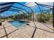 Inviting screened pool with brick pavers at 22419 Bette Ave, Port Charlotte, FL 33954